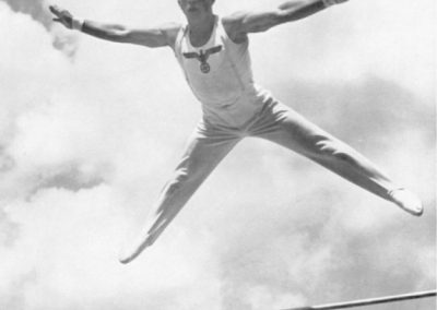 A German gymnast dismounting the high bar