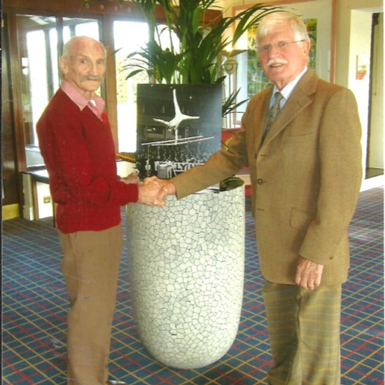 Dick with Jack Scrivener in 2014 with Jack presenting Dick with the Alan Burrows photo of Dick taken at the Albert Hall British Championships in 1962.